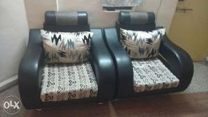 Two Black-and-white Fabric Sofa Armchairs With Throw Pillows