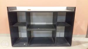 Used TV stand made of particle board