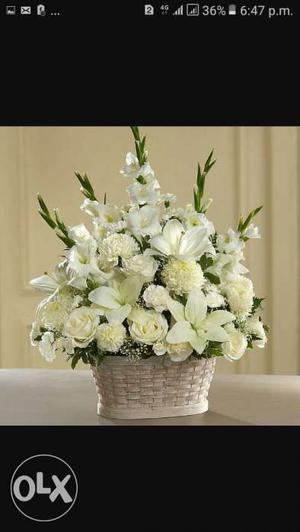 White Flower Arrangement With Wicker Pot