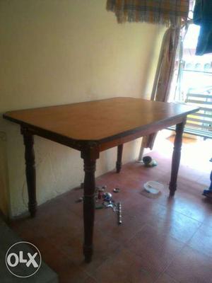 Wooden dining table with size of 3x4.5 an height