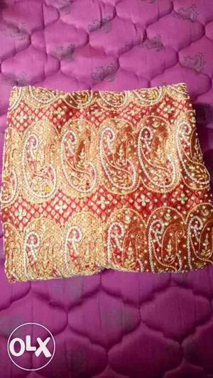 Yellow And Red Paisley Print Textile