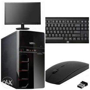 Black Flat Screen Monitor With Keyboard, Mouse, And Computer
