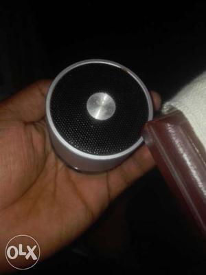 Round Black And Grey Portable Bluetooth Speaker