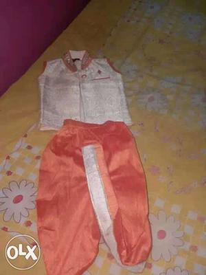 Toddler's Beige Sleeveless Shirt And Pink Pants Set