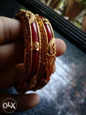 Gold-colored And Red Bangles