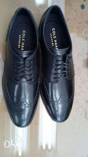 Pair Of Black Cole Haan Leather Wingtip Dress Shoes