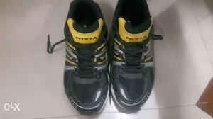 Pair Of Black-and-yellow Nivia High Top Sneakers