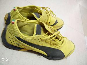 Pair Of Black-and-yellow Puma Ferrari Shoes