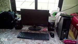 Black Computer Flat Screen Monitor; Tower; Keyboard; Mouse