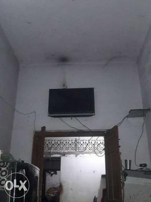 Black Flat Screen TV; Black Wooden TV Stand