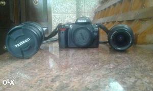 Black Nikon DSLR Camera With Tamron Telephoto Lens