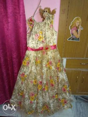 Golden gown for girls ( yrs) almost new