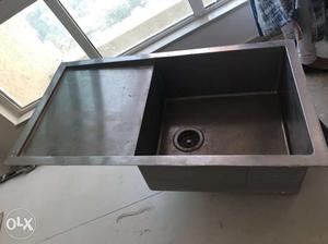 Stainless steel sink with drainboard