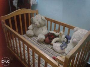Baby's Brown Wooden Crib