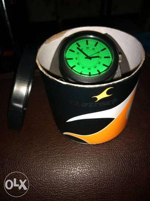Fastrack watch. green and black