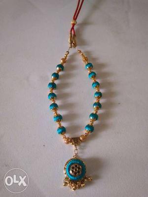 Gold-colored And Blue Floral Medallion Necklace