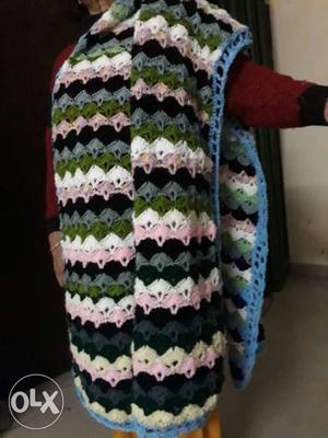 Handmade woollen shawl. Newly crochet knitting.