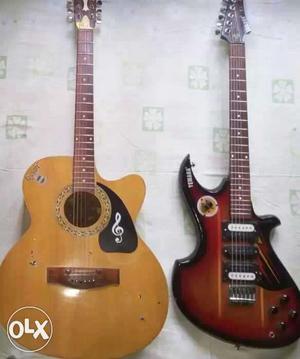 Natural Acoustic Guitar And Red Electric Guitar