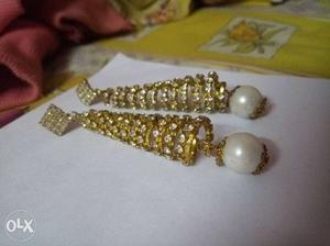 Pair Of Gold-colored Diamond Encrusted Earrings