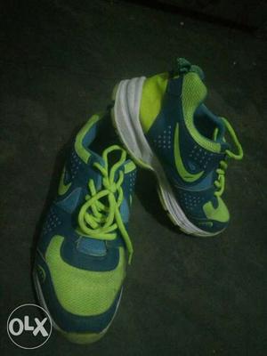 Pair Of Green-and-blue Nike Running Shoes