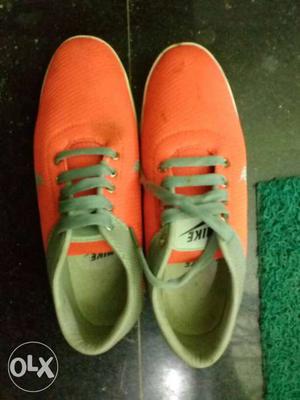 Pair Of Orange Nike Low-top Sneakers