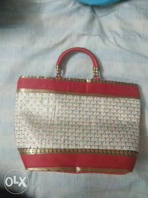 Red, White, And Gold Leather Handbag