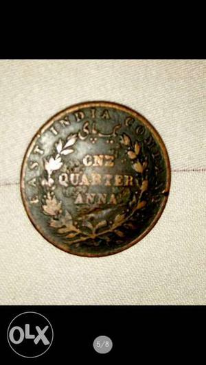 Round Bronze-colored One Quarter Coin