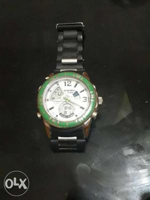 Round White And Green Chronograph Watch With Silver Link