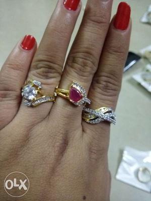 Three Diamond Encrusted Gold-colored Rings