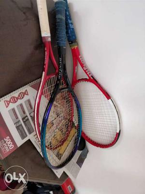Three Red, Blue, And Pink Tennis Rackets