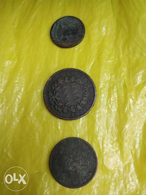 Three Round Black Indian Coins