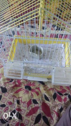 White And Yellow Metal Wire Pet Cage