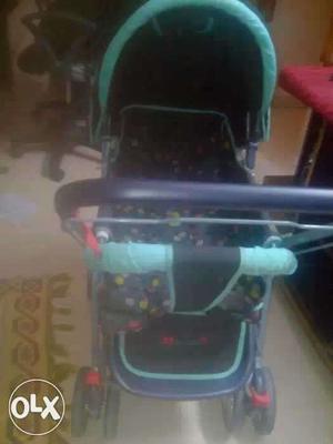 Baby's Black And Teal Pram Stroller