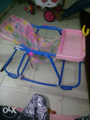 Baby's Blue And Pink Rocking Highchair