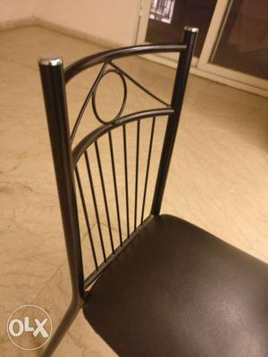Black Cushioned Chair With Silver Frame