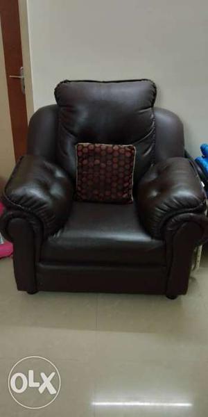Brown couch With Throw Pillow