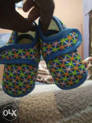 Pair Of Baby's Blue-yellow-and-orange Crib Shoes