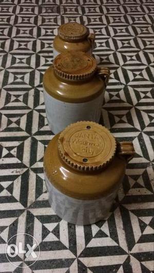 Three White-and-beige Ceramic Jars