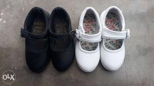 Two Pairs Of White And Black Mary Jane Shoes
