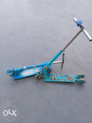 Two Teal Kick Scooters