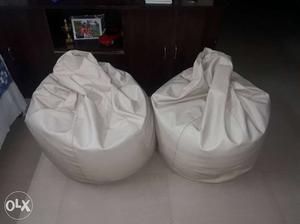 Two White Leather Bean Bag Chairs