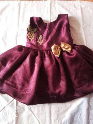 Vine red satin frock with golden satin bows,with