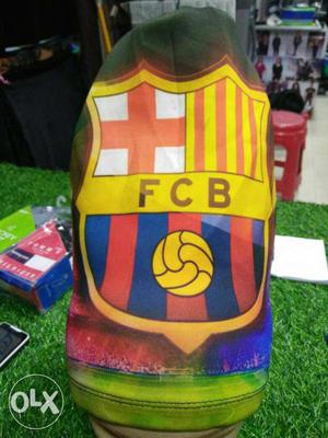 Yellow, Blue, Red, And White FCB Shield Soccer Team Logo