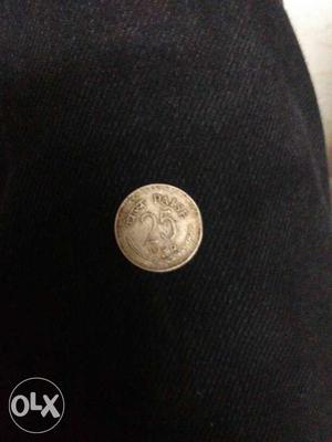 25 Round Silver-colored Indian Paise Coin