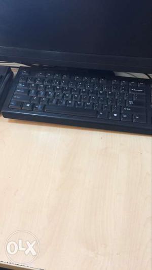 Flat Screen Monitor And Black Keyboard