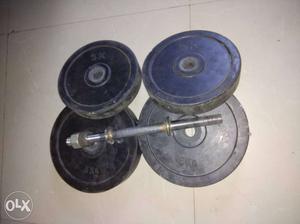 Four Black rubber Dumbbell Plates