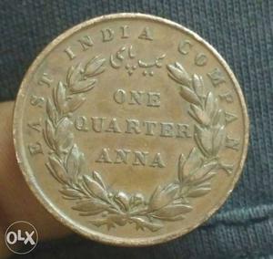 Gold-colored One Quarter Anna Coin