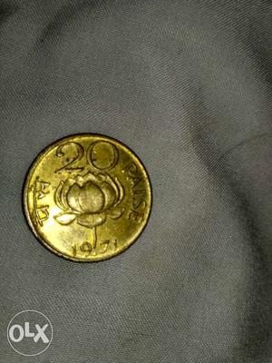 Round Gold-colored 20 Indian Paise Coin