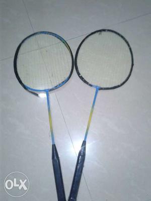 Two Black-and-teal Badminton Rackets