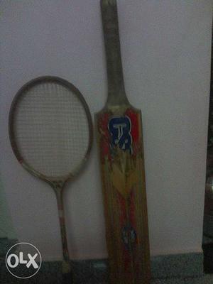 Beige Wooden Cricket Bat And Beige Badminton Racket